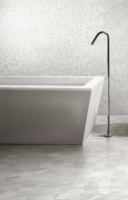 contemporary bathroom with a grey hexagonal tile floor and mosaic wall